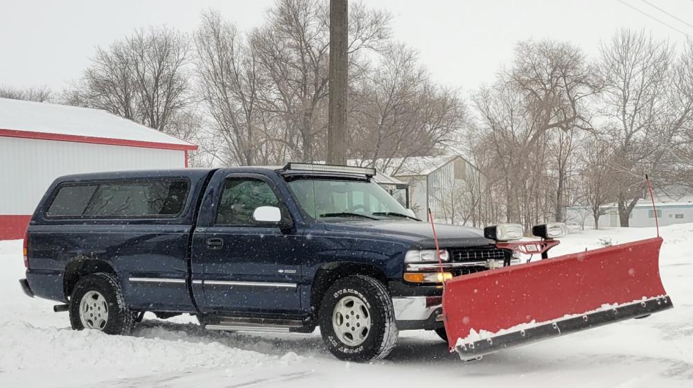 pickup truck with snowplow in Ravinia, South Dakota