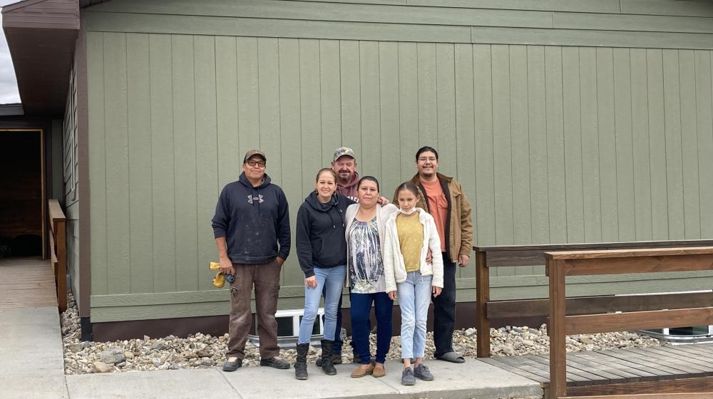 Vikki Shoulders with family outside her new home