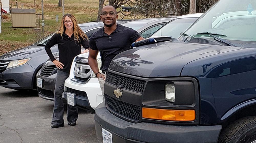 Harvest Outreach Center staff pose with new vehicles purchased with Emergency Rural Healthcare Grant funding.