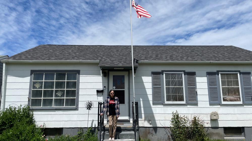 Mildred showing off the new roof on her Washakie County, WY home.