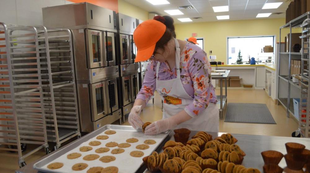 Workers at the Arc Bakery making their cookie