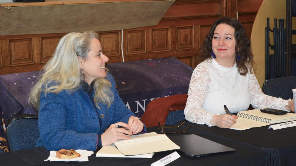 Christa Shute of NEK Broadband, left, talks with Jenille Smith of CVFiber at the Fairbanks Museum in St. Johnsbury, VT, during a meeting with VT Senator Peter Welch and USDA Deputy Secretary Xochitl Torres-Small