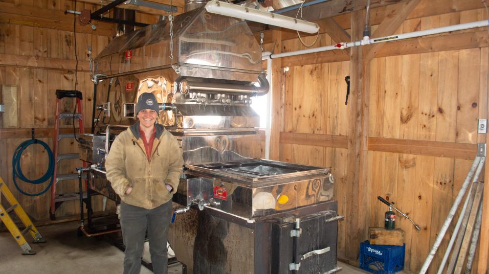 Kate Goyette of Sweet Bear Farm in Corinth, VT, shows off a steamaway boiler unit