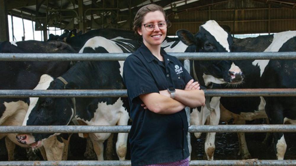 Woman in front of cows 