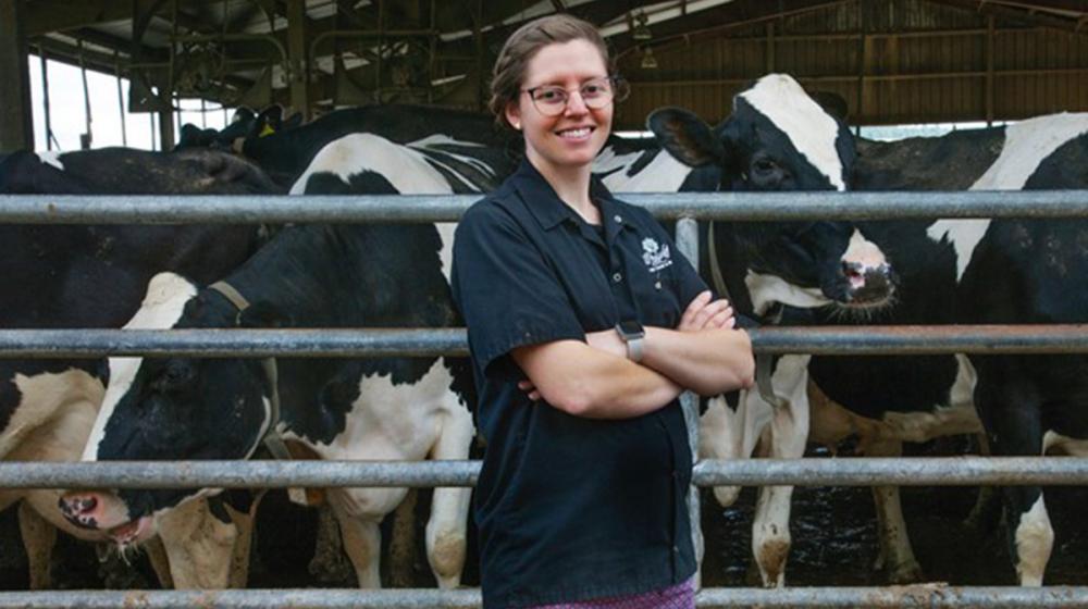 Woman in front of cows