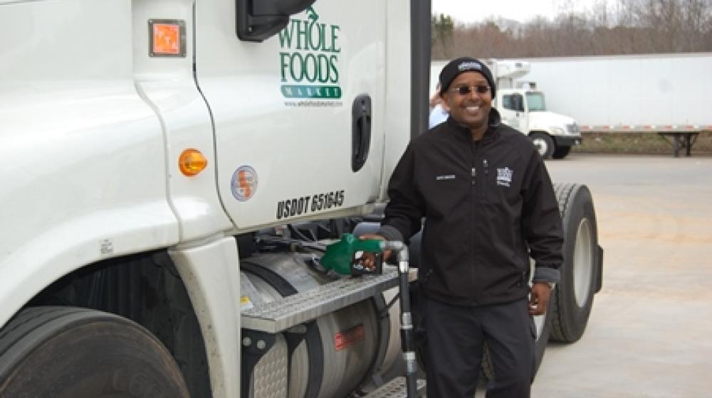The Clean Energy Biofuels team pose in front of new biodiesel fuel pump