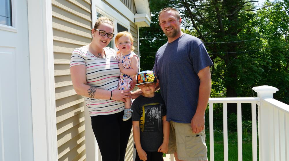The Hodgdon Family stand on their front porch