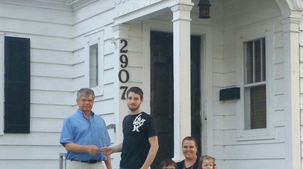 The Moons receive the keys to their new home