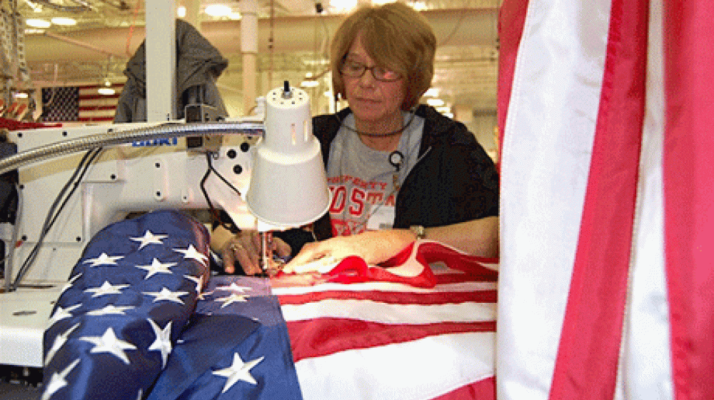 In this photo, courtesy of Annin Flagmakers, employee Carol Wolfe sews an American flag at the company&#039;s Coshocton, Ohio facility. 