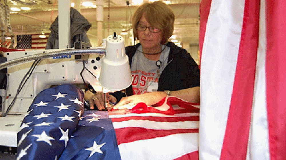 In this photo, courtesy of Annin Flagmakers, employee Carol Wolfe sews an American flag at the company's Coshocton, Ohio facility.