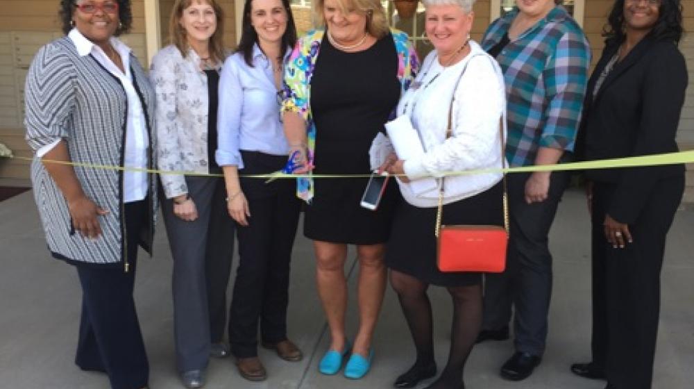 Members of Virginia Housing Development Authority, Surber Development LLC, and USDA Rural Development Virginia gather to cut ribbon at Lily Ridge Apartments ribbon cutting ceremony.