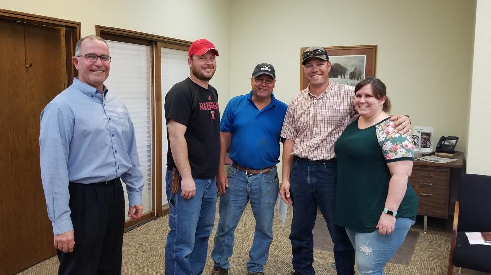 Everyone is smiling. The transfer of ownership is complete!