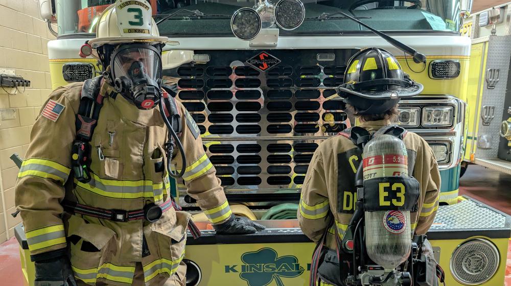 Cople District firefighters Donald and Ryan King wearing SCBA equipment. 
