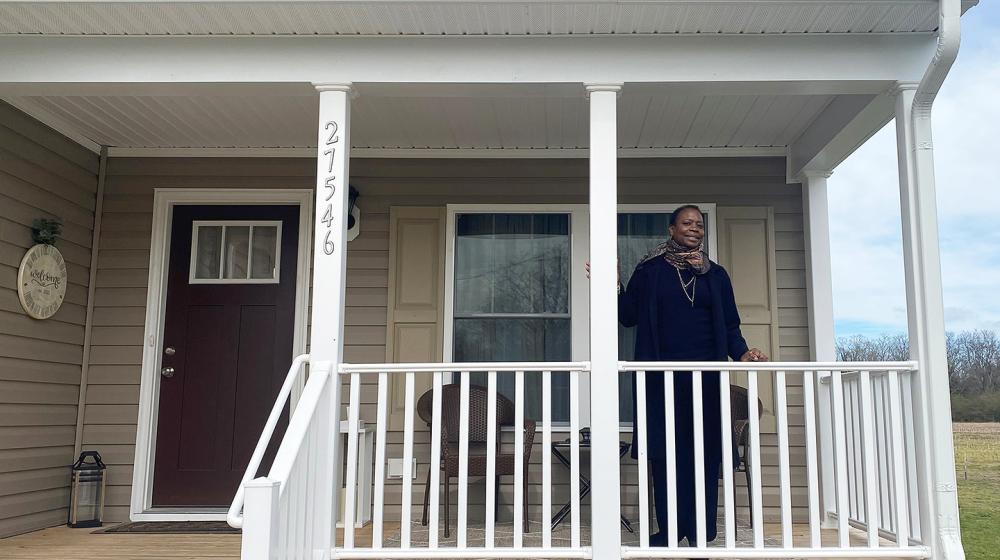 Cora Suzette Lee on the front porch of her new home.