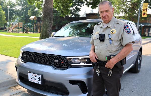 Marshal Larry Rose with one of the new police vehicles 