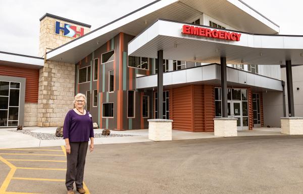 CEO Margie Molitor standing in front of Hot Springs Health.