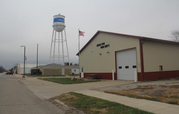 The Moulton volunteer fire department station with the US flag flying in front of in lies along the main street in town.