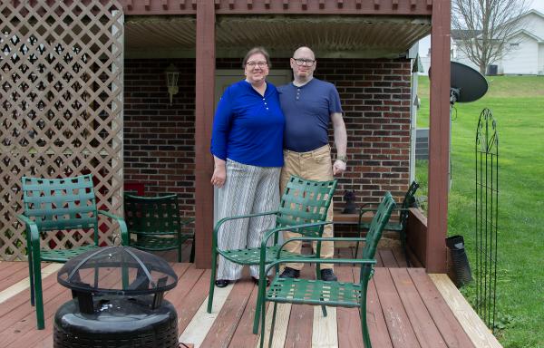 Mary Ann and Eric Forrester on the back deck of their new home purchased with help from USDA Rural Development