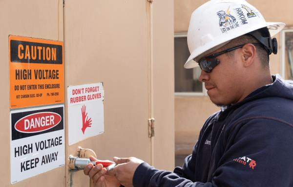 Man prepares to open electric box