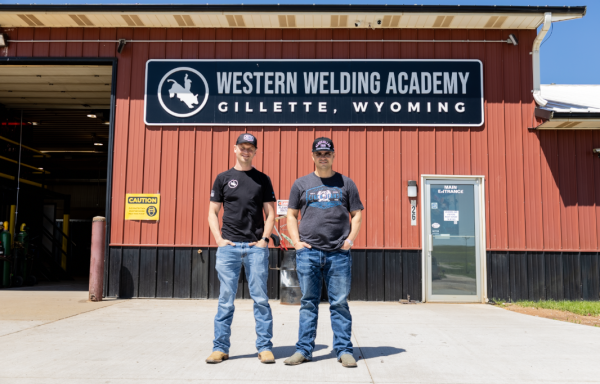 Beau Barkley, Director of Creative & Brand Partnerships, and Tyler Sasse, Founder & Owner of Western Welding Academy, stand in front of the elite welding school that recruits students from around the country.