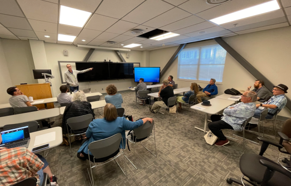 Danny Dehaze, Executive Director of Infrastructure, leading a session on instructional technology at the Fall 2023 Faculty In-Service, discussing the Zoom room hubs, new classroom technology, student information systems, and other service items