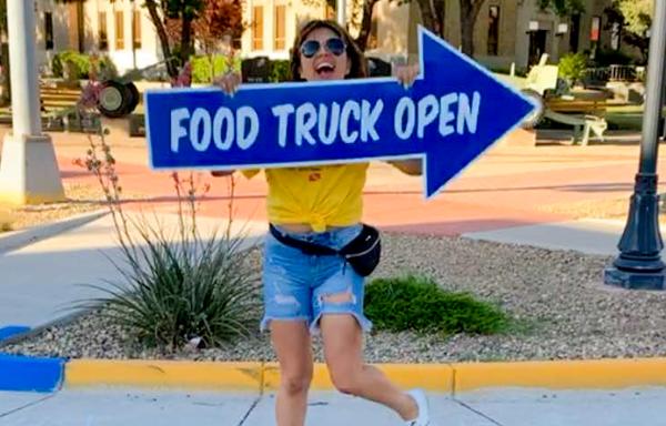 Lovington Mainstreet Executive Director Mara Salcido directs customers to the ‘Local Innovators Institute’ food truck called “Big Blue”