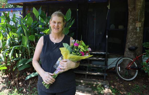 Ms. Cynthia Veal holding flowers 