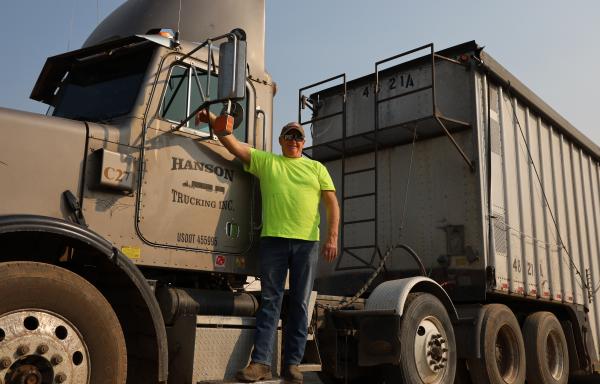 Man in front of truck