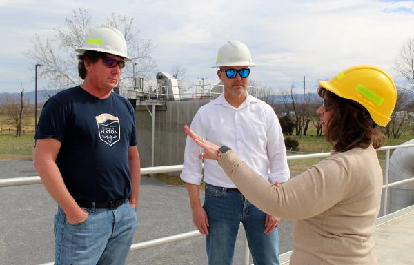 Town officials conferring with an RD staffer at the wastewater treatment plant site.