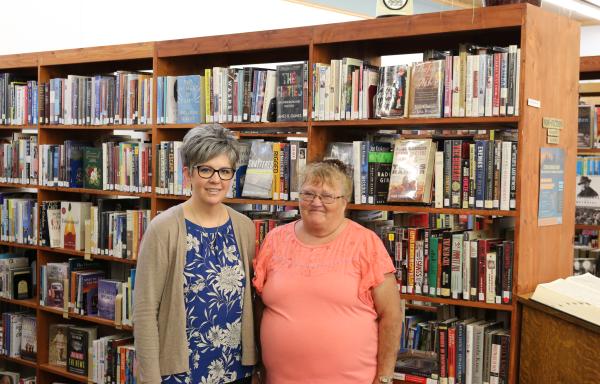 Librarians present and past, Tina Peterson (L) and Kathleen Schreiber (R) in Harlowton's Library. 