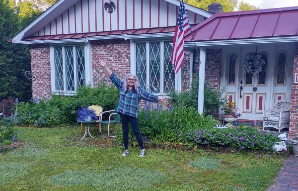 Joyce Caldwell outside her new home