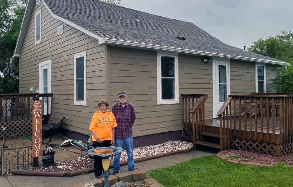 Bob and Mary Ann Volk outside their remodeled home in Herreid, SD.