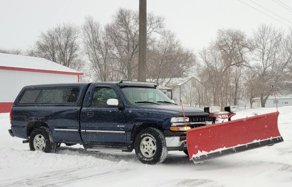 pickup truck with snowplow in Ravinia, South Dakota