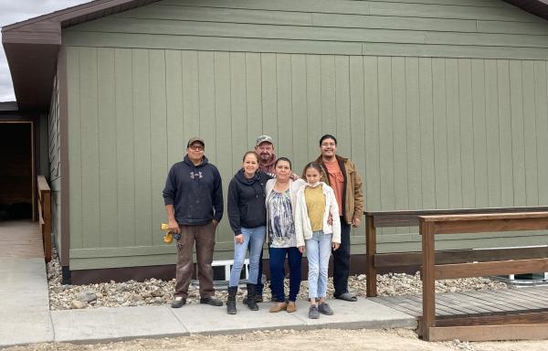 Vikki Shoulders with family outside her new home