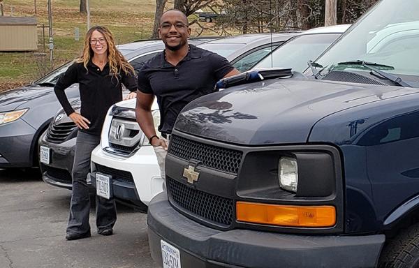 Harvest Outreach Center staff pose with new vehicles purchased with Emergency Rural Healthcare Grant funding.