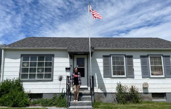 Mildred showing off the new roof on her Washakie County, WY home.