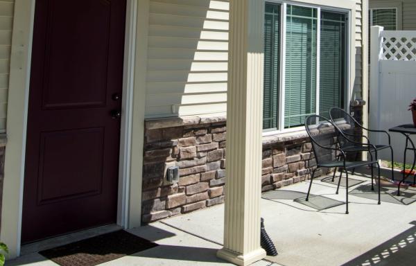 door to a home, sidewalk, patio, pillar