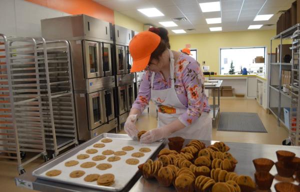 Workers at the Arc Bakery making their cookie