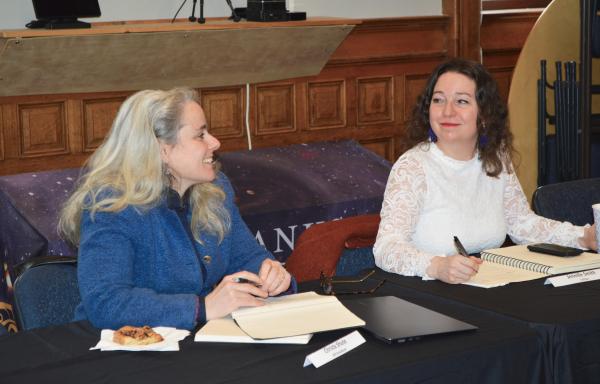 Christa Shute of NEK Broadband, left, talks with Jenille Smith of CVFiber at the Fairbanks Museum in St. Johnsbury, VT, during a meeting with VT Senator Peter Welch and USDA Deputy Secretary Xochitl Torres-Small