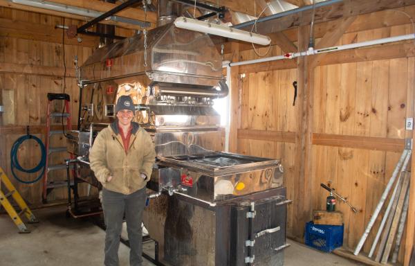 Kate Goyette of Sweet Bear Farm in Corinth, VT, shows off a steamaway boiler unit