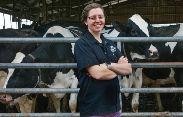 Woman in front of cows 