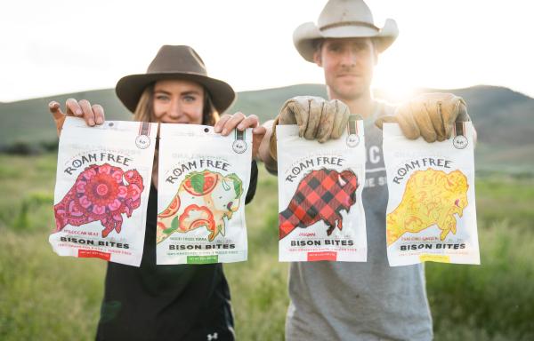 People holding bison jerkey