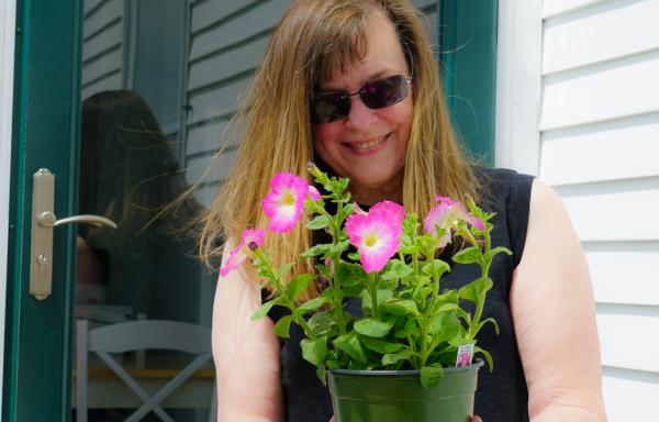 New Homeowner Kate McGowan with flowers