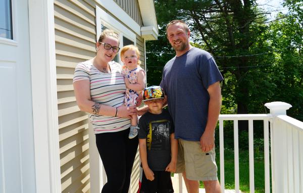 The Hodgdon Family stand on their front porch