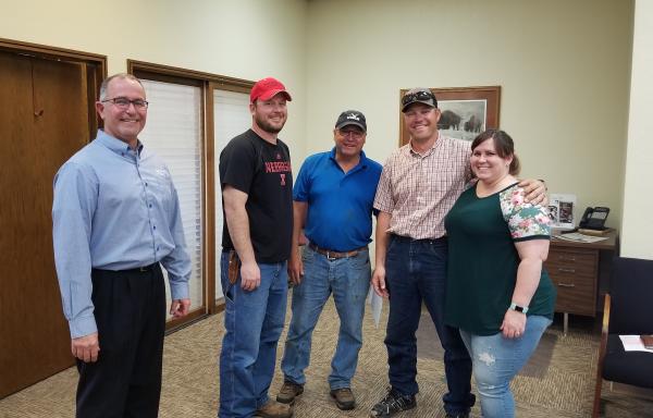 Everyone is smiling. The transfer of ownership is complete!