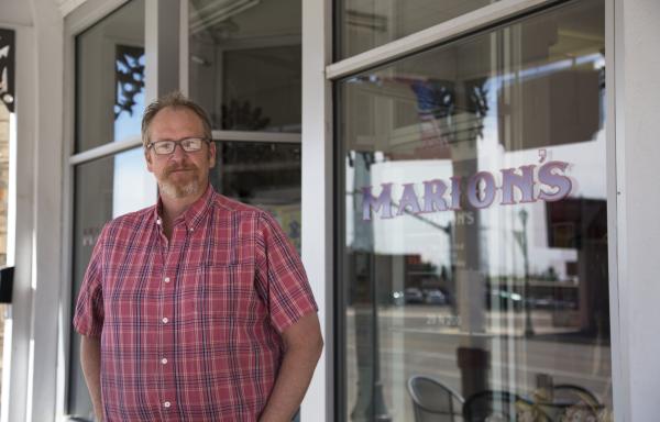 Chad Mortensen outside his variety store