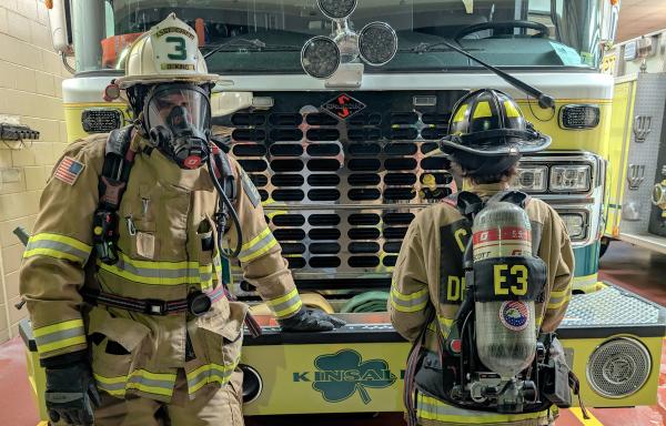 Cople District firefighters Donald and Ryan King wearing SCBA equipment. 