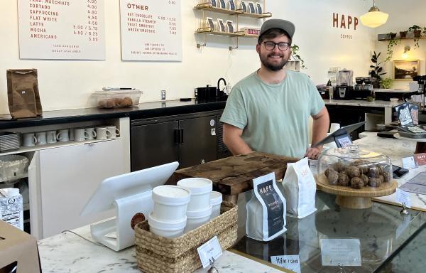 Mallory behind the counter at Happ Coffee.