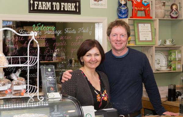 Two owners behind store counter
