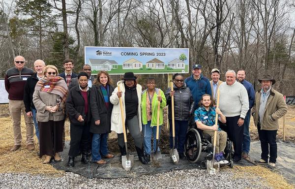 Group photo of new borrowers and Piedmont Habitat for Humanity team